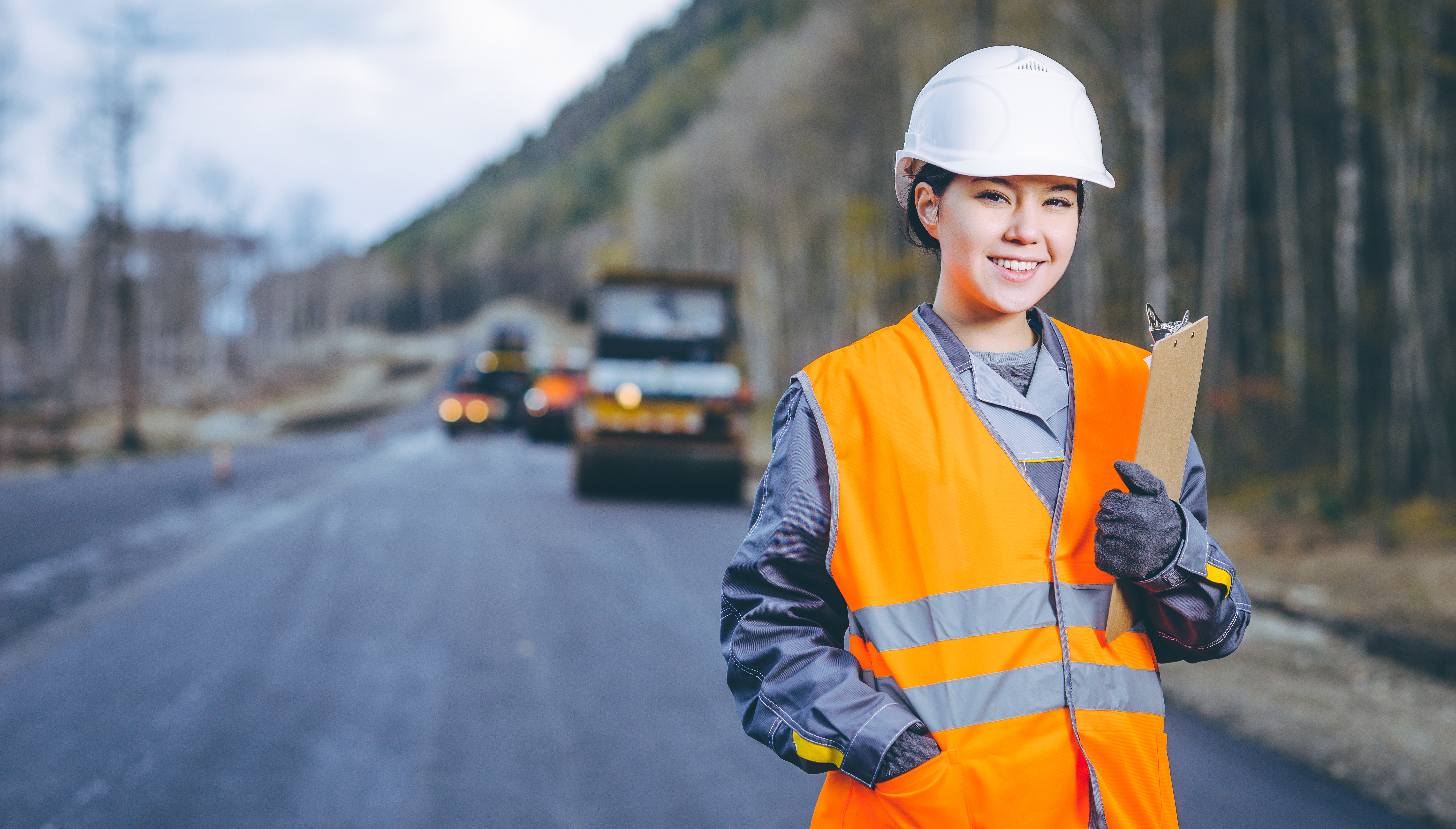 Female worker on a highway construction site